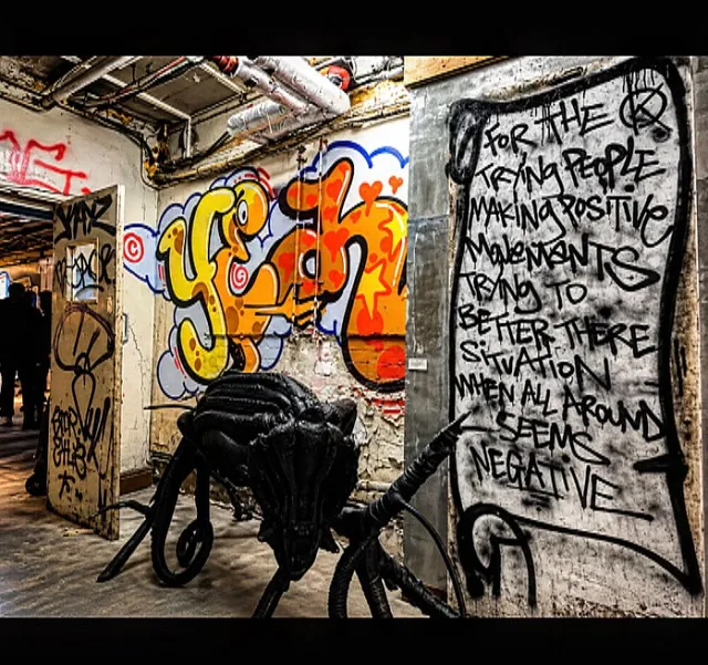 Graffiti lettering and an art installation inside a large room